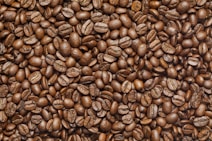 brown coffee beans on black textile