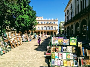 Scene from a busy international book fair with people browsing stands