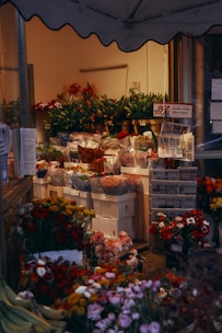 red and green flower bouquet on white wooden shelf