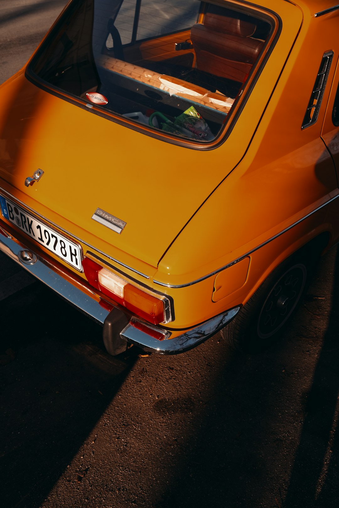 orange car on black asphalt road