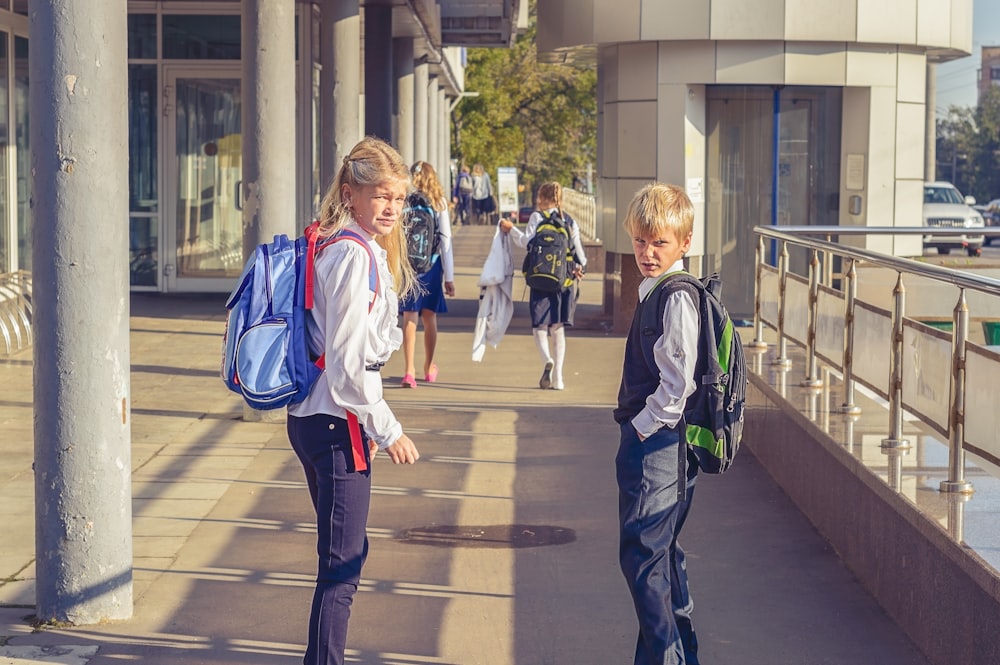 people walking on sidewalk during daytime