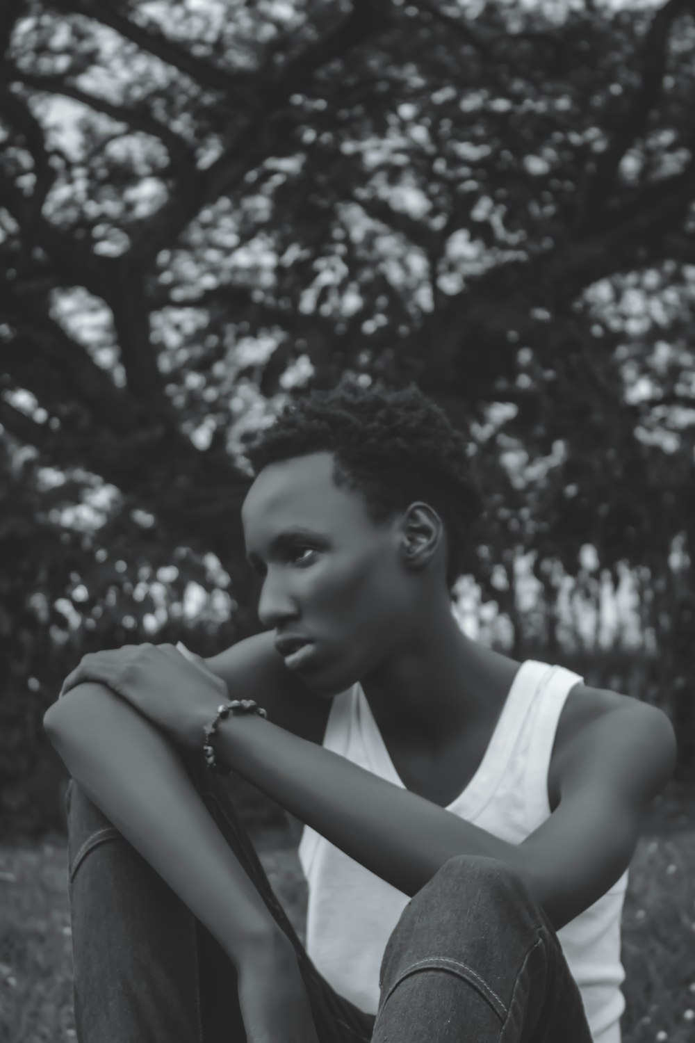 grayscale photo of woman in tank top