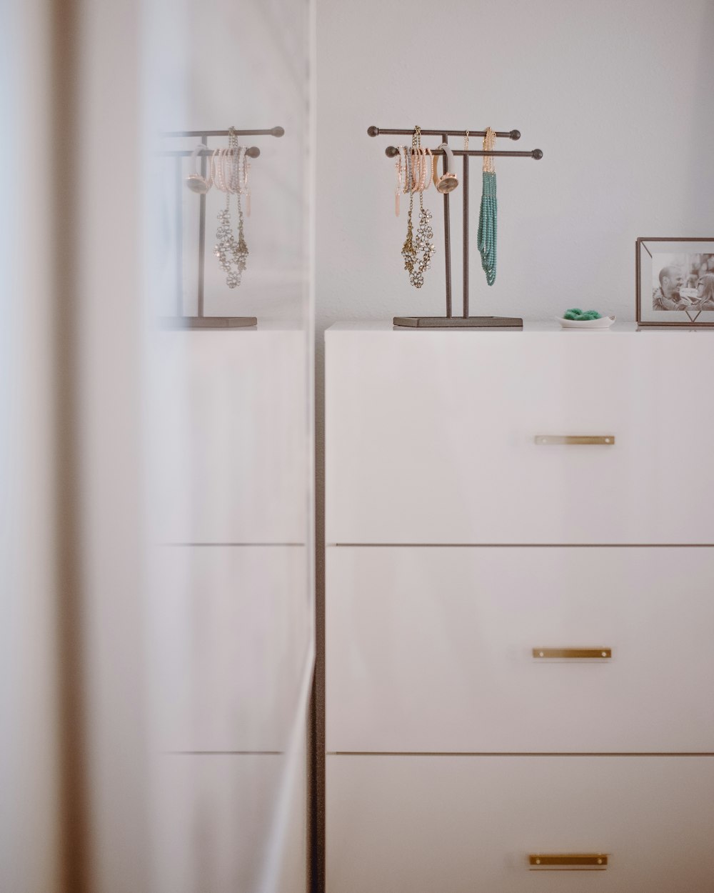 white wooden cabinet with mirror