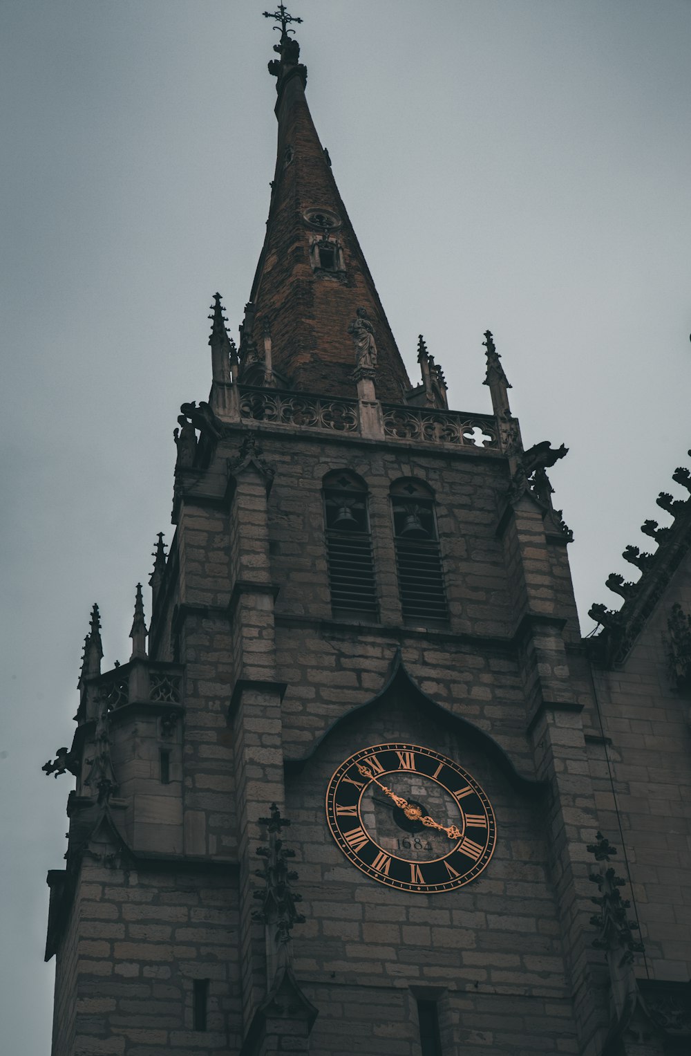 brown concrete building with clock