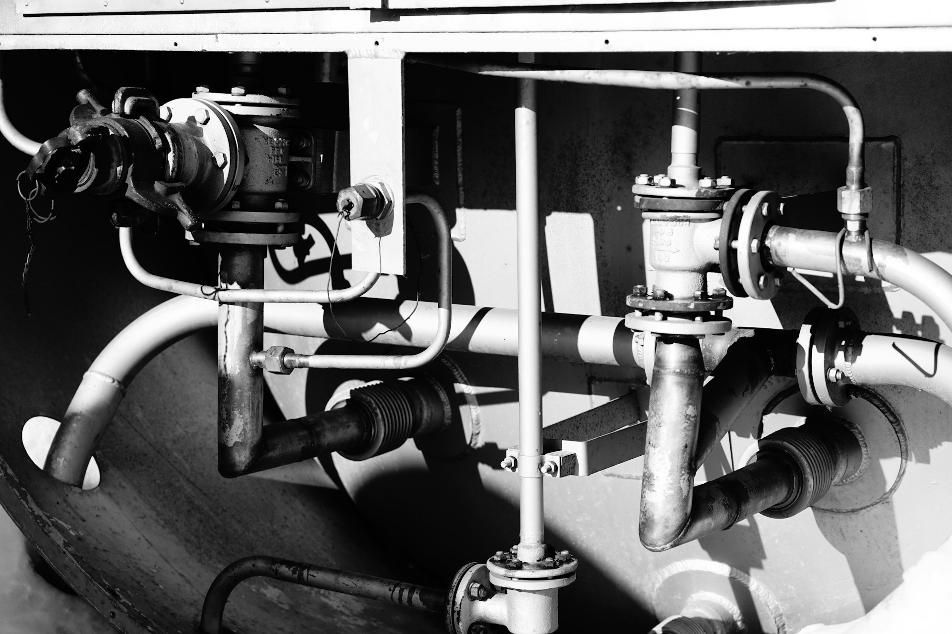 grayscale photo of metal pipe