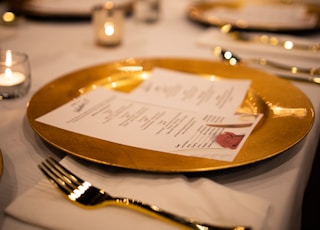 stainless steel fork and knife on white ceramic plate