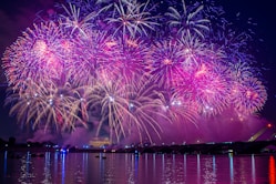 fireworks display over body of water during night time