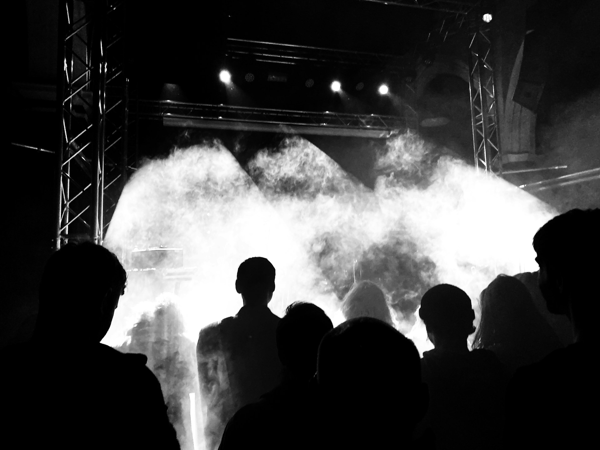 silhouette of people standing on stage