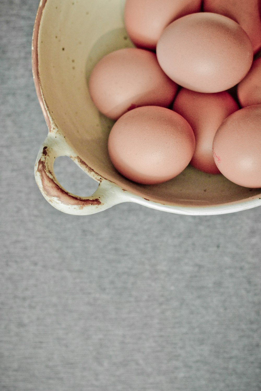 brown eggs in white ceramic mug