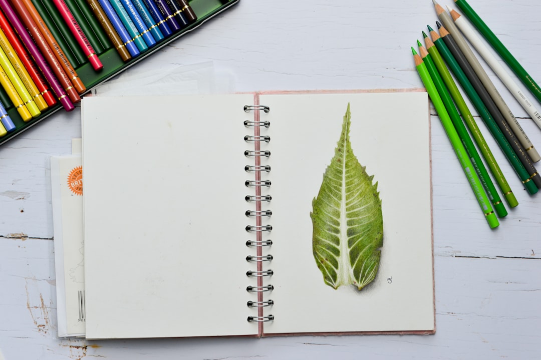 green leaves on white notebook