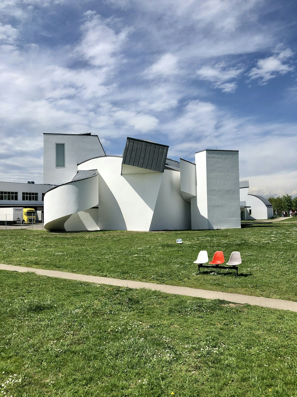 white concrete building near green grass field during daytime