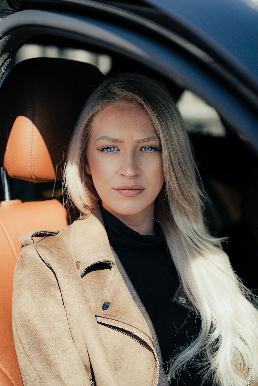 woman in brown coat smiling