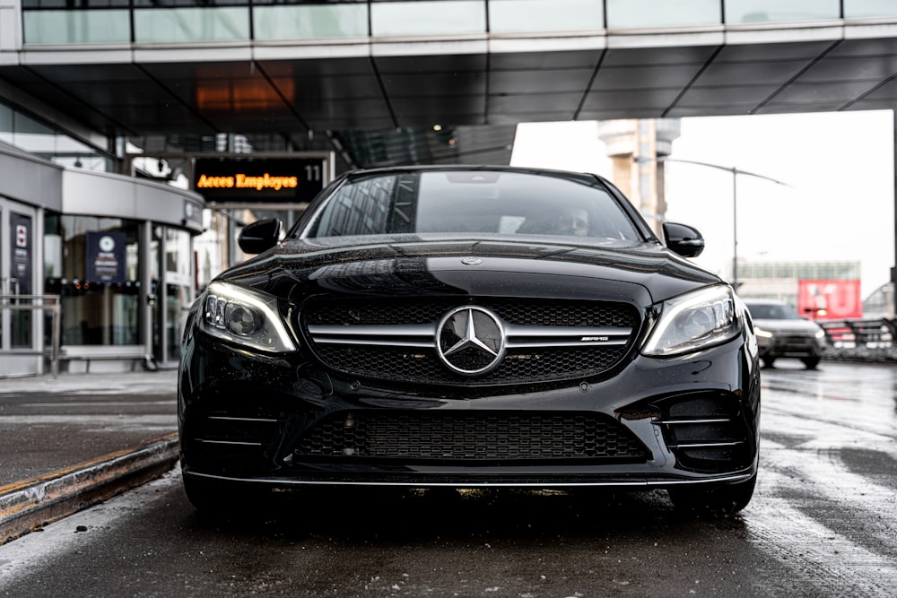 black mercedes benz car on road during daytime