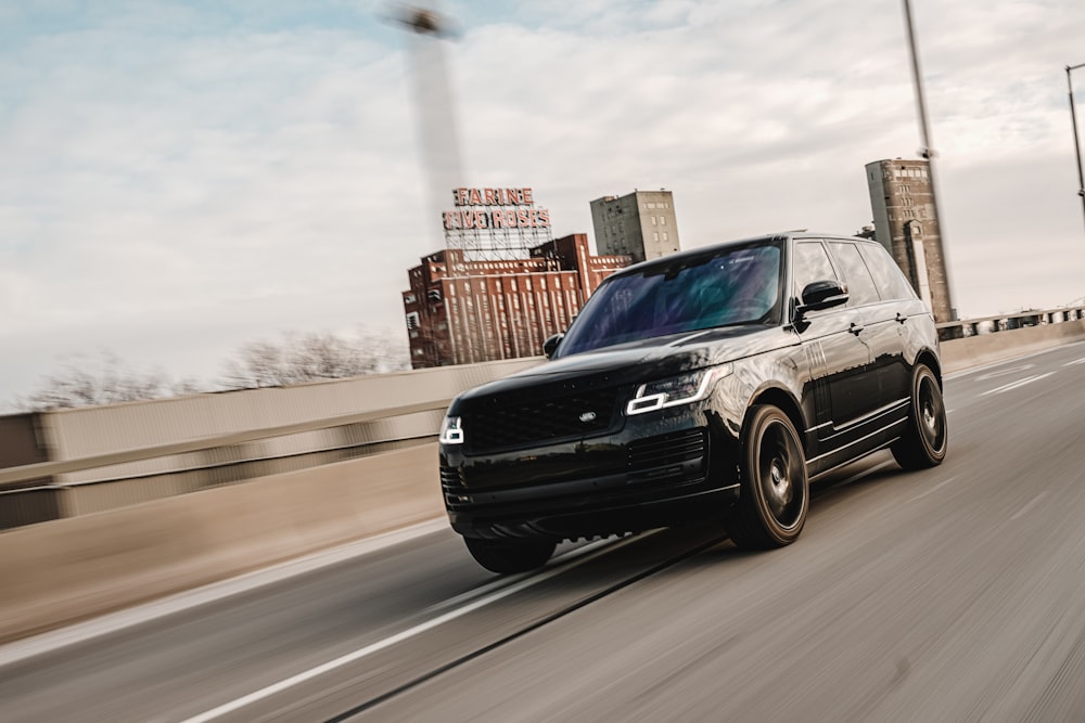 black chevrolet crew cab pickup truck on road during daytime