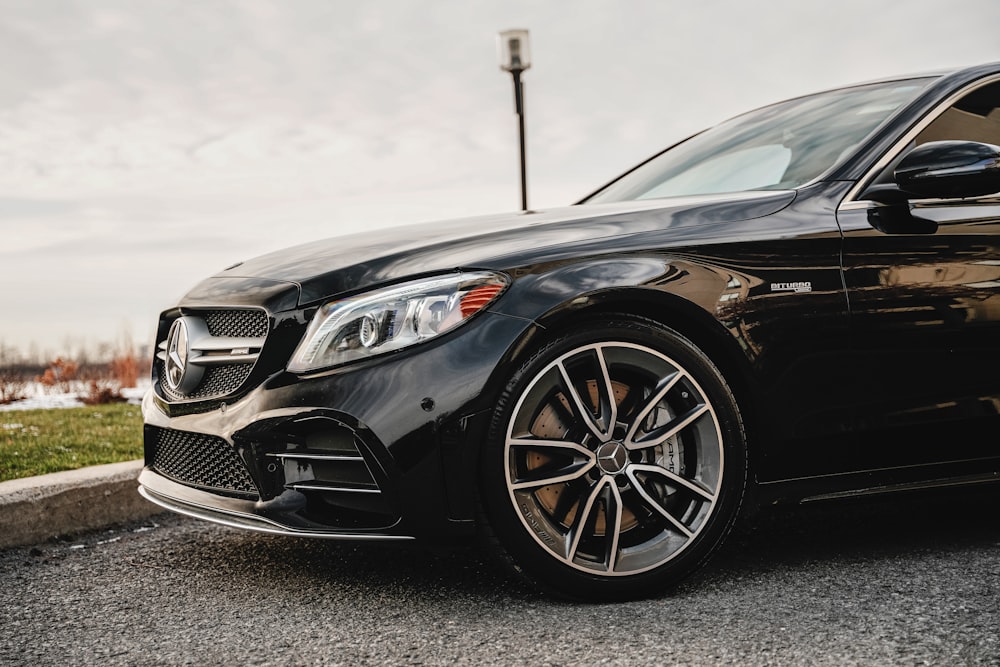 black mercedes benz coupe on road during daytime