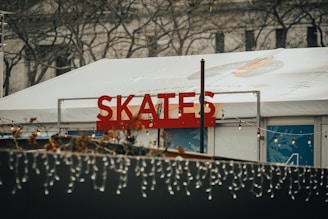 The entrance of Rollerhub decorated with vibrant banners announcing weekend skating events.