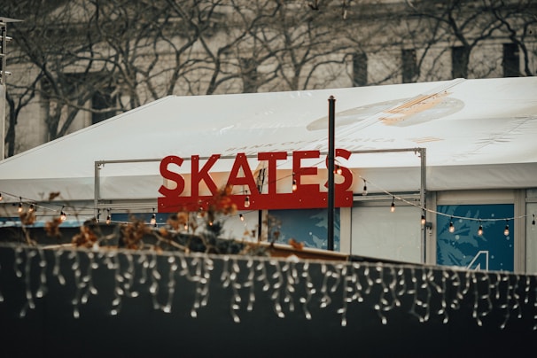 The entrance of Rollerhub decorated with vibrant banners announcing weekend skating events.