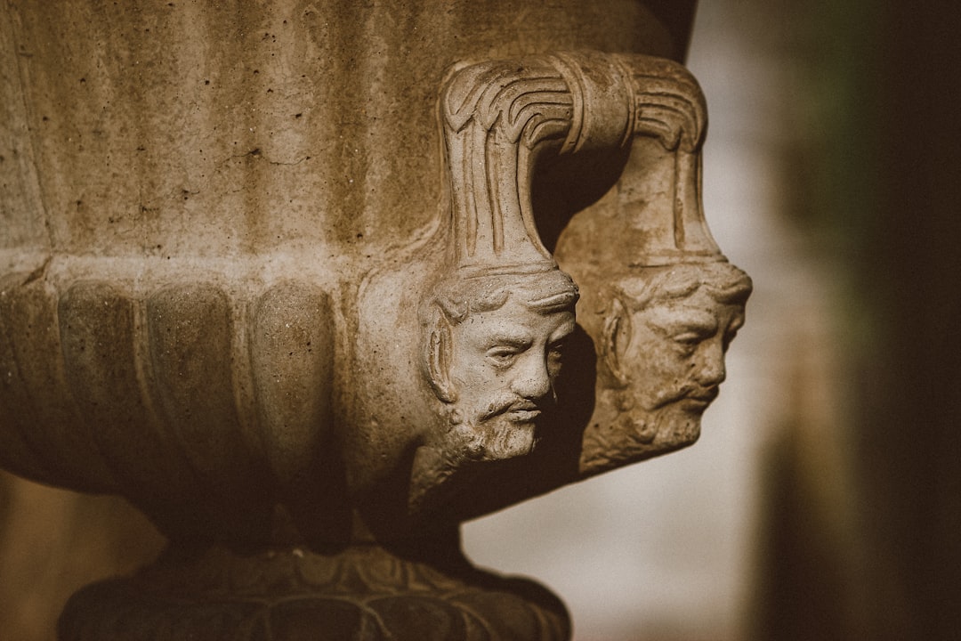 brown concrete statue of man