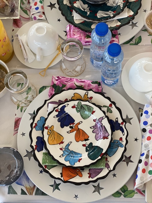 A vibrant assortment of colorful paper plates and napkins laid out on a festive table.