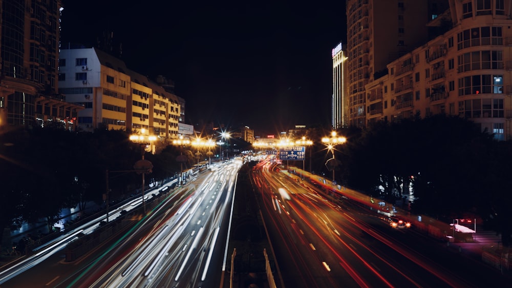 time lapse photography of cars on road during night time