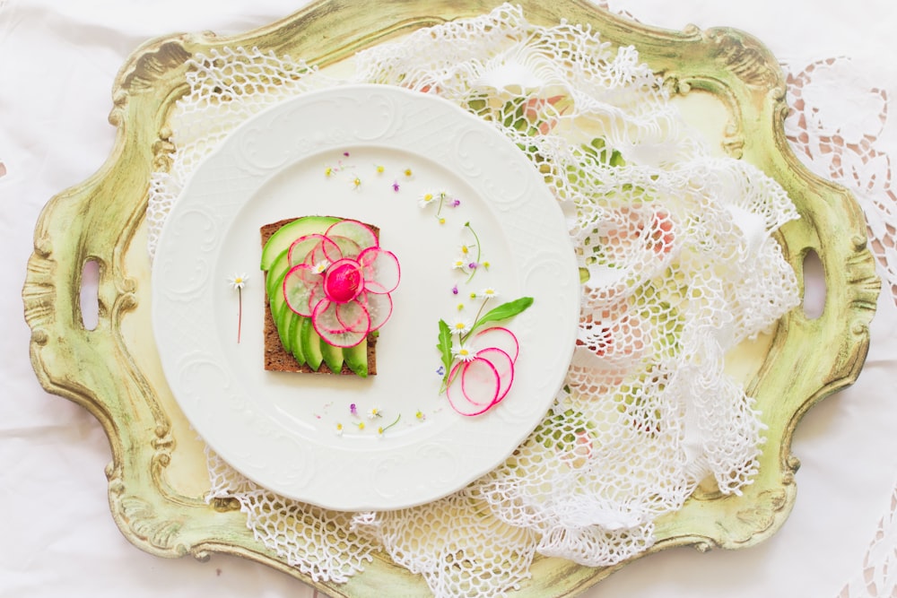 white and pink floral ceramic plate