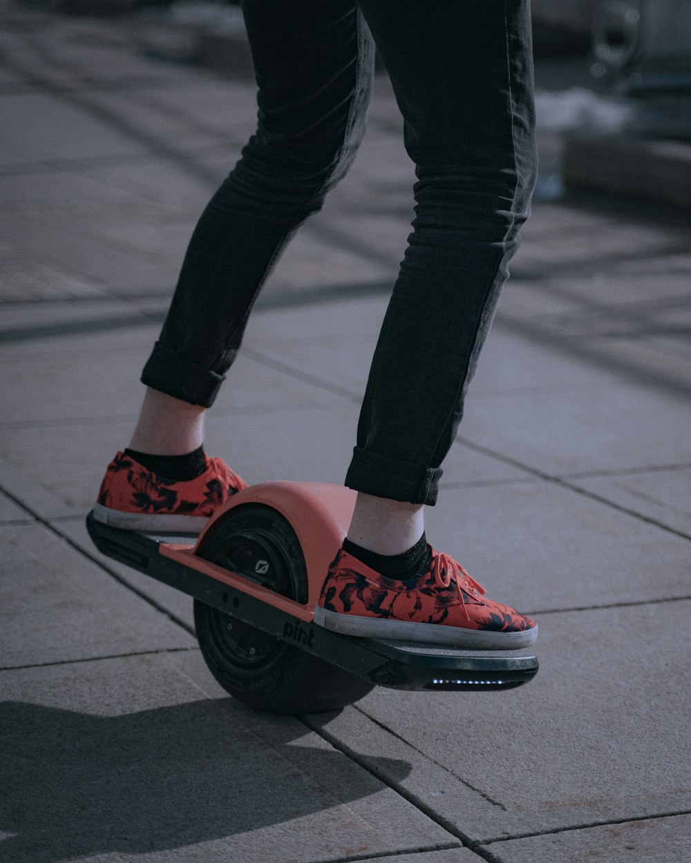 person in red and black nike sneakers