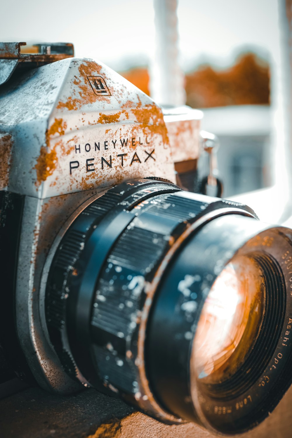 black camera lens on brown wooden table