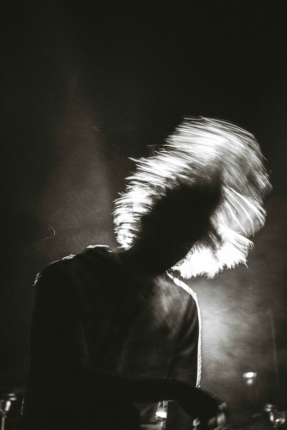 man in black shirt with white hair