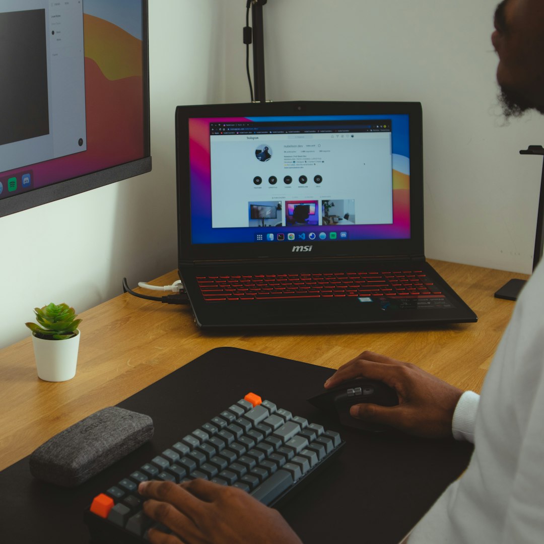 person using black laptop computer