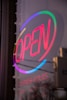 purple and white open neon light signage