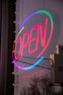 purple and white open neon light signage