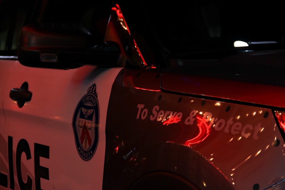 red and white car in a dark room