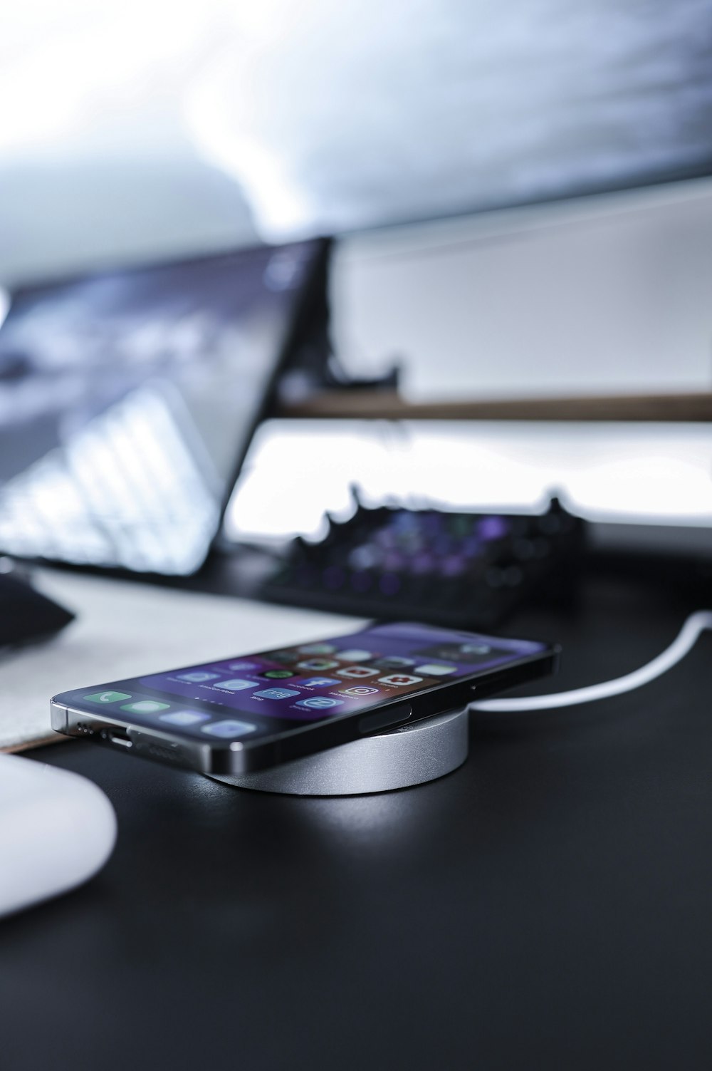 black iphone 7 on black table