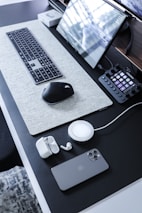 A minimalist office setup featuring sleek tech gadgets and ambient lighting.