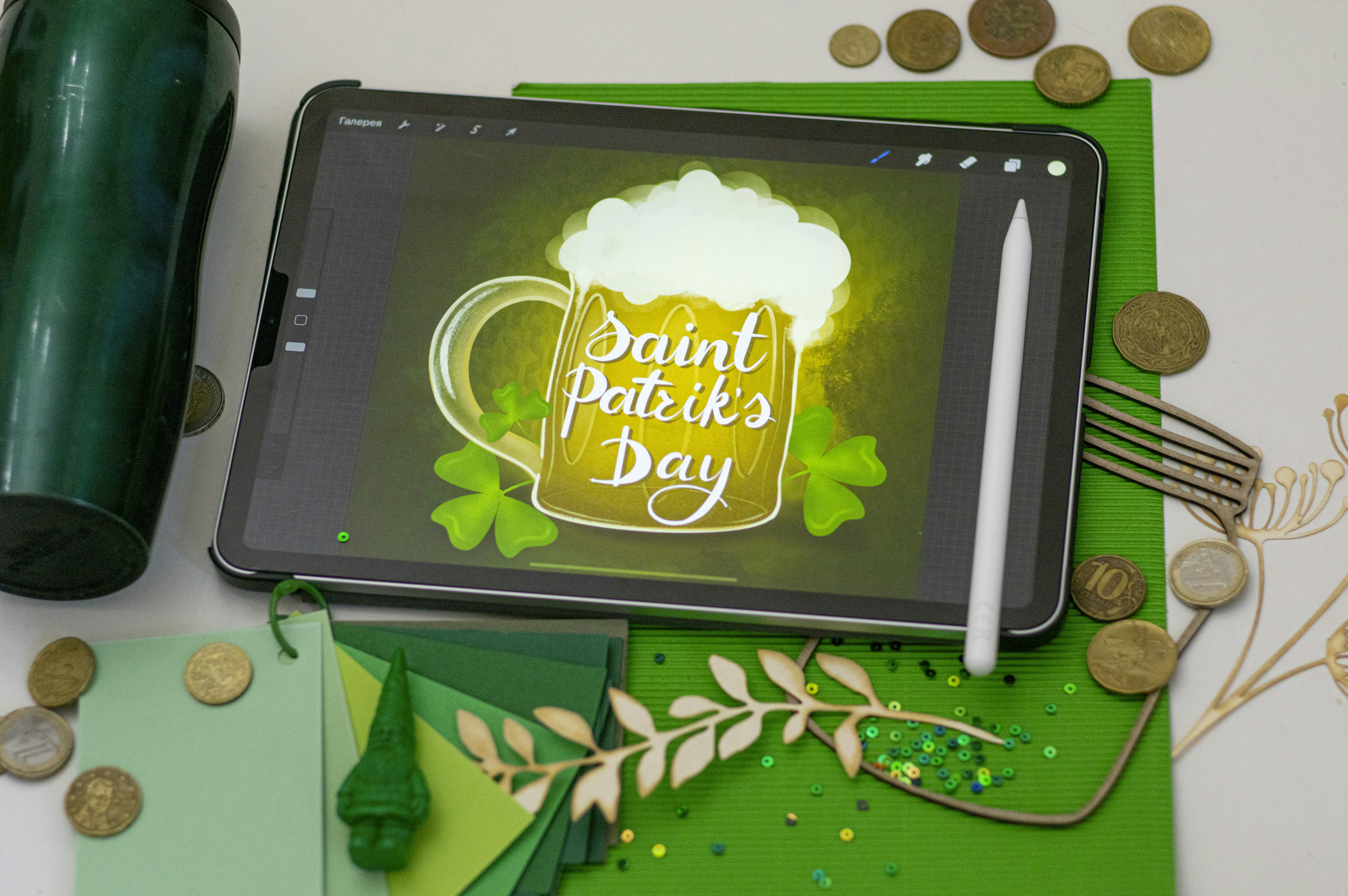 black tablet computer on green and brown textile