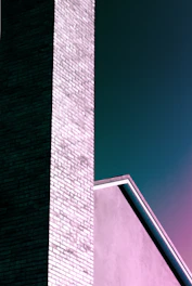 brown brick wall under blue sky during daytime