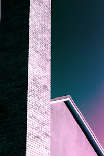 brown brick wall under blue sky during daytime