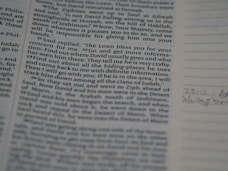 A close-up view of a printed page from a book, displaying text in two columns. On the right, there is a lined section with some handwritten notes. The text is in English and appears to be from a religious or historical book.