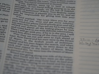 A close-up view of a printed page from a book, displaying text in two columns. On the right, there is a lined section with some handwritten notes. The text is in English and appears to be from a religious or historical book.