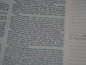 A close-up view of a printed page from a book, displaying text in two columns. On the right, there is a lined section with some handwritten notes. The text is in English and appears to be from a religious or historical book.