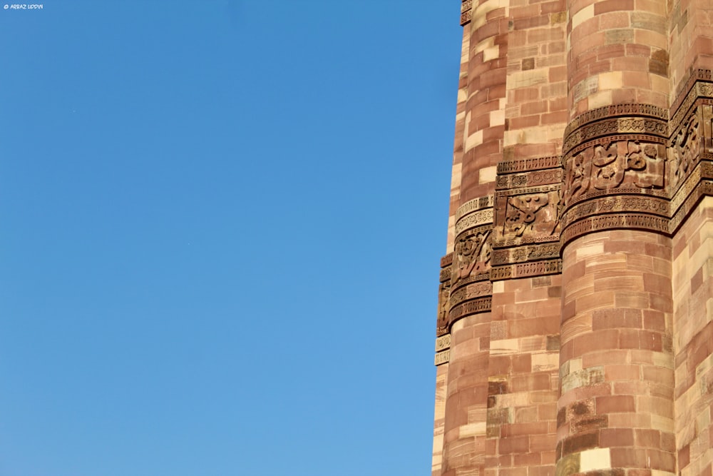 brown concrete tower under blue sky during daytime