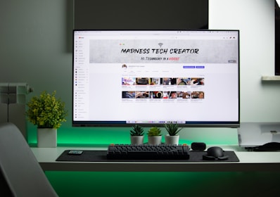 black flat screen computer monitor turned on displaying facebook page