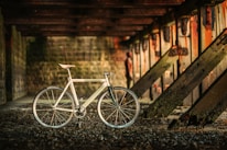 Vintage-inspired bicycle with a sleek, modern twist displayed in a warm, off-white studio.