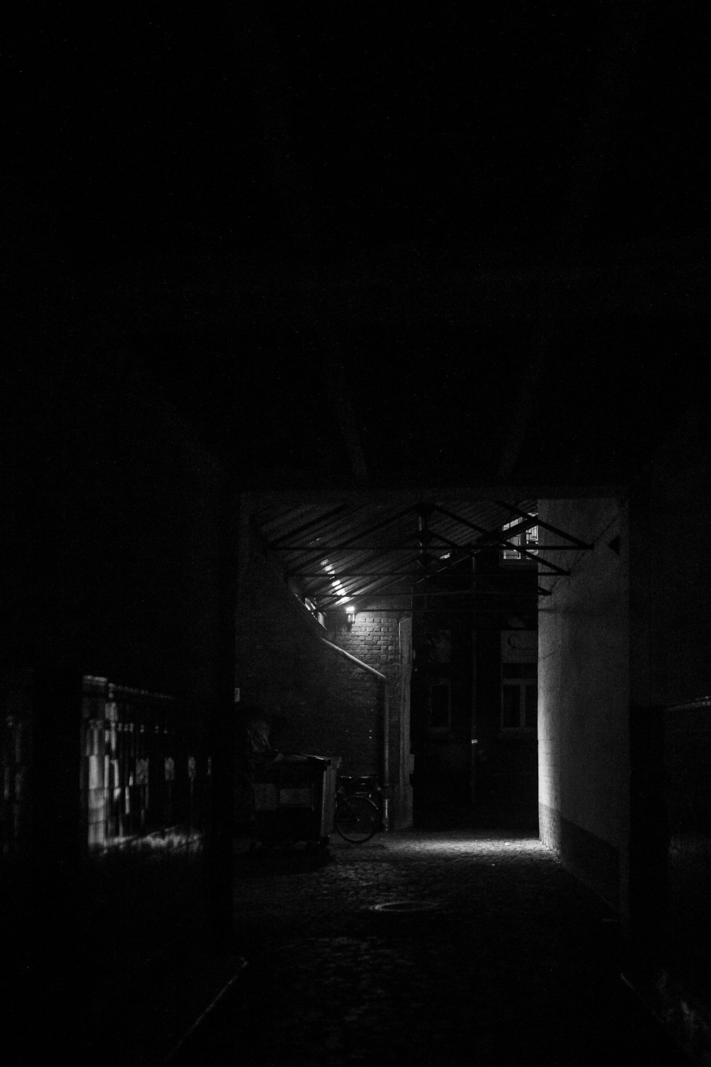 grayscale photo of empty hallway