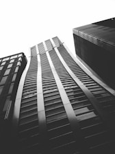 A sleek black and white photo of a modern Cleveland cityscape at dusk, reflecting professionalism and focus.
