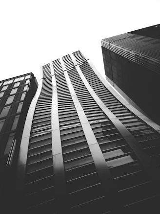 A sleek, minimalist black and white photo of Luxembourg's financial district at dusk, reflecting professionalism and luxury.
