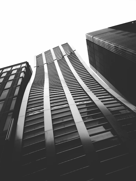 A sleek, minimalist black and white photo of Luxembourg's financial district at dusk, reflecting professionalism and luxury.