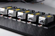Various spare parts for industrial power supplies arranged neatly on a table.