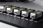 Various spare parts for industrial power supplies arranged neatly on a table.