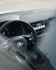 black car in a road during daytime